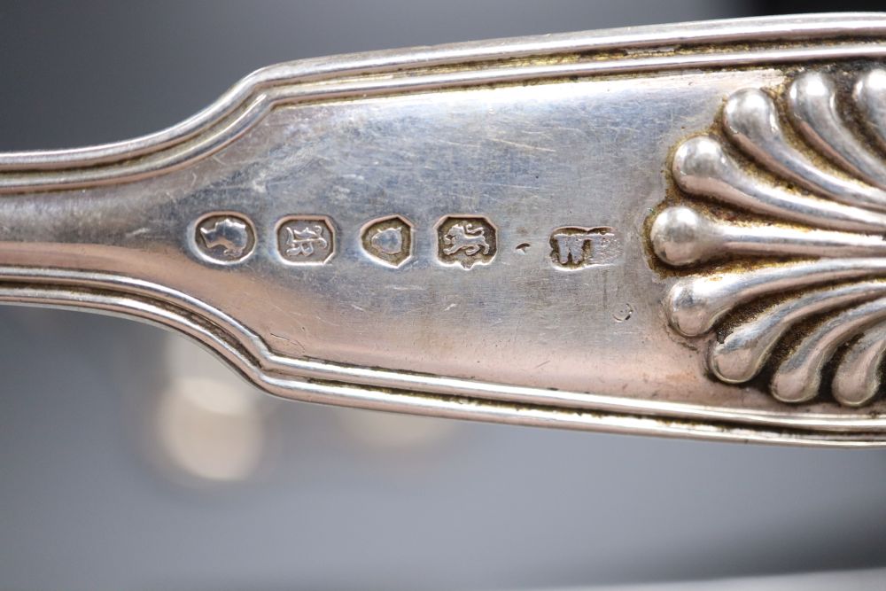 Four Victorian silver fiddle, thread and shell pattern table spoons & 4 dessert spoons.
